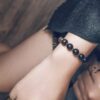 Fu Mo Xuan Tong black obsidian and brass bracelet worn with dark layered clothing