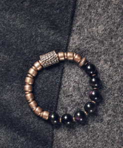 Full Fu Mo Xuan Tong black obsidian and textured brass bracelet on dark fabric