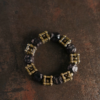 Hunyuan Panjie Style B ebony bracelet with square cage brass knot beads