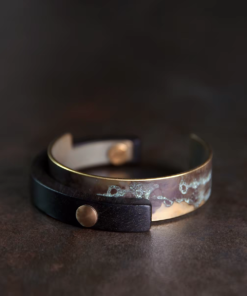Front detail of Tai Su Xuan Mu mottled brass and ebony cuff bracelet