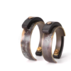 Pair display showing the open construction of Tai Su Xuan Mu cuff bracelets
