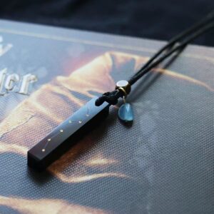 Big Dipper Obsidian & Aquamarine Pendant — dark rectangular pendant with a small blue charm