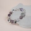 Chinese Zodiac Rat Bracelet — clear and purple bead bracelet against a pale display