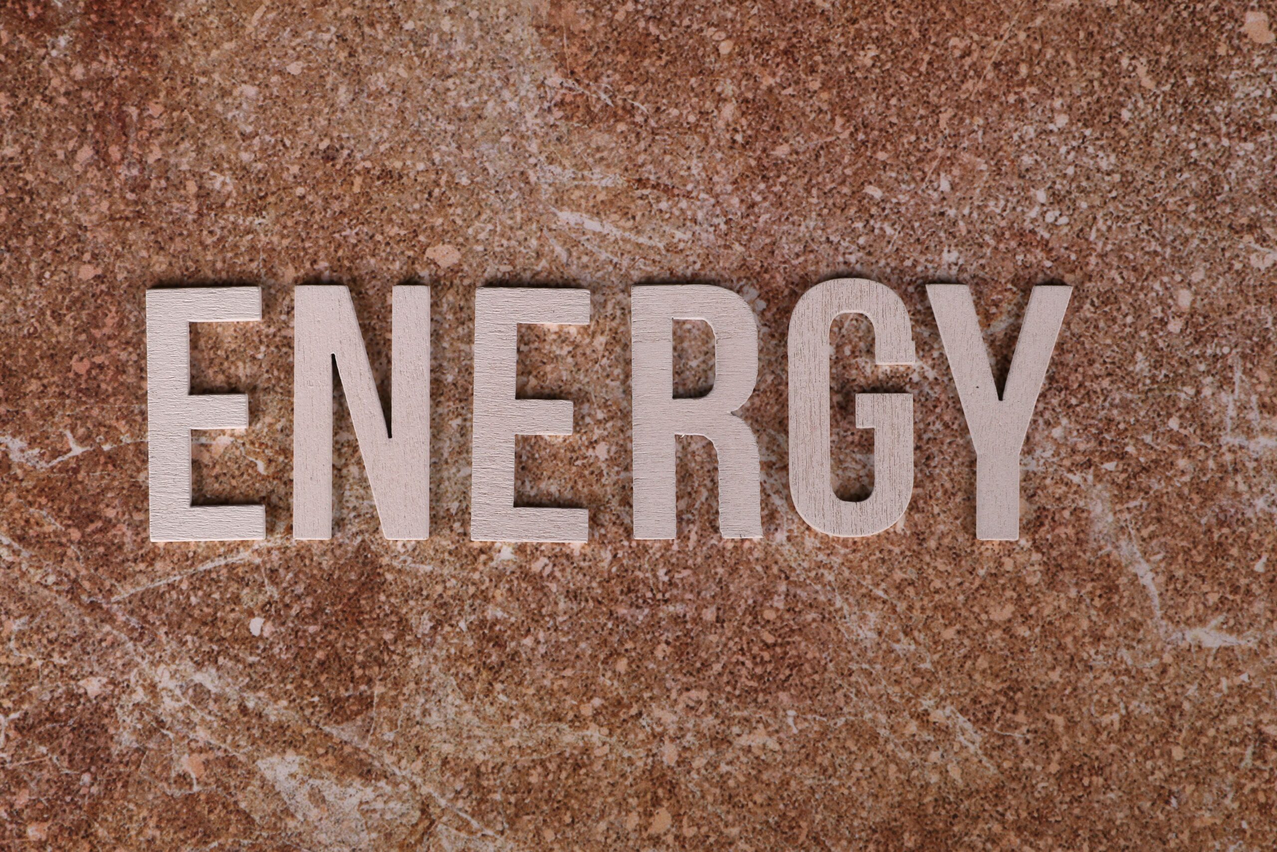 The word ENERGY on a brown textured background