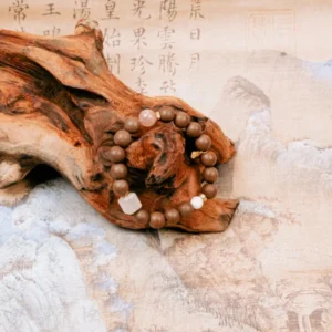 Feizi Xiao Goose Pear Herbal Incense Bracelet — brown bead bracelet with pale accents arranged around wood