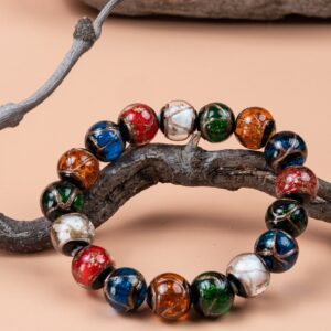 Five-Color Incense Ash Liuli Bead Bracelet — multicolored bead bracelet encircling a branch
