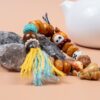 Fuling Agarwood & Bodhi Bead Bracelet — close view of bracelet tassels and mixed beads on stones
