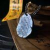 Golden Light Mantra 999 Silver Gilded Pendant — reverse of oval pendant showing rows of writing