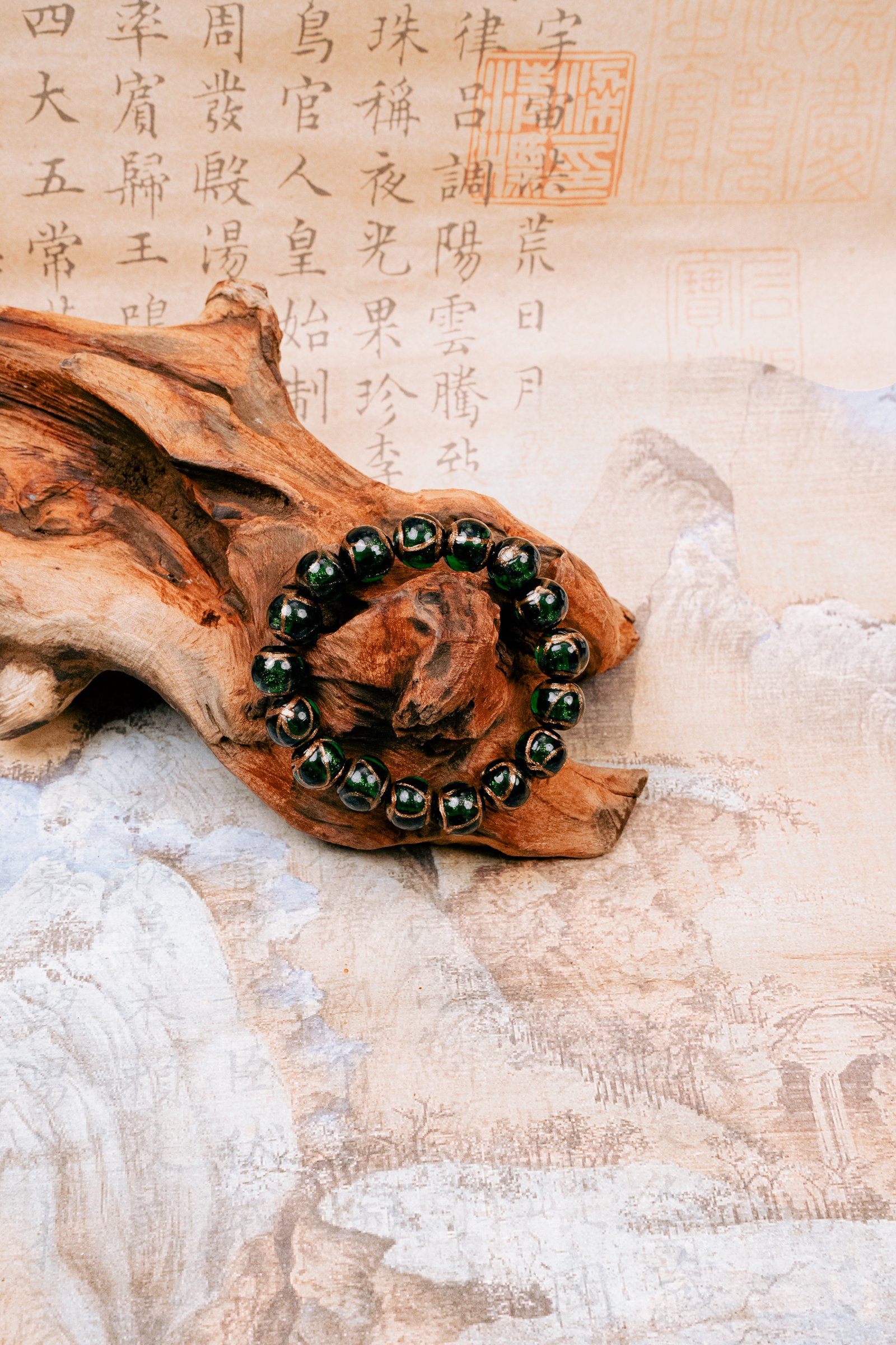 Green Incense Ash Liuli Bead Bracelet — green bead bracelet arranged around wood