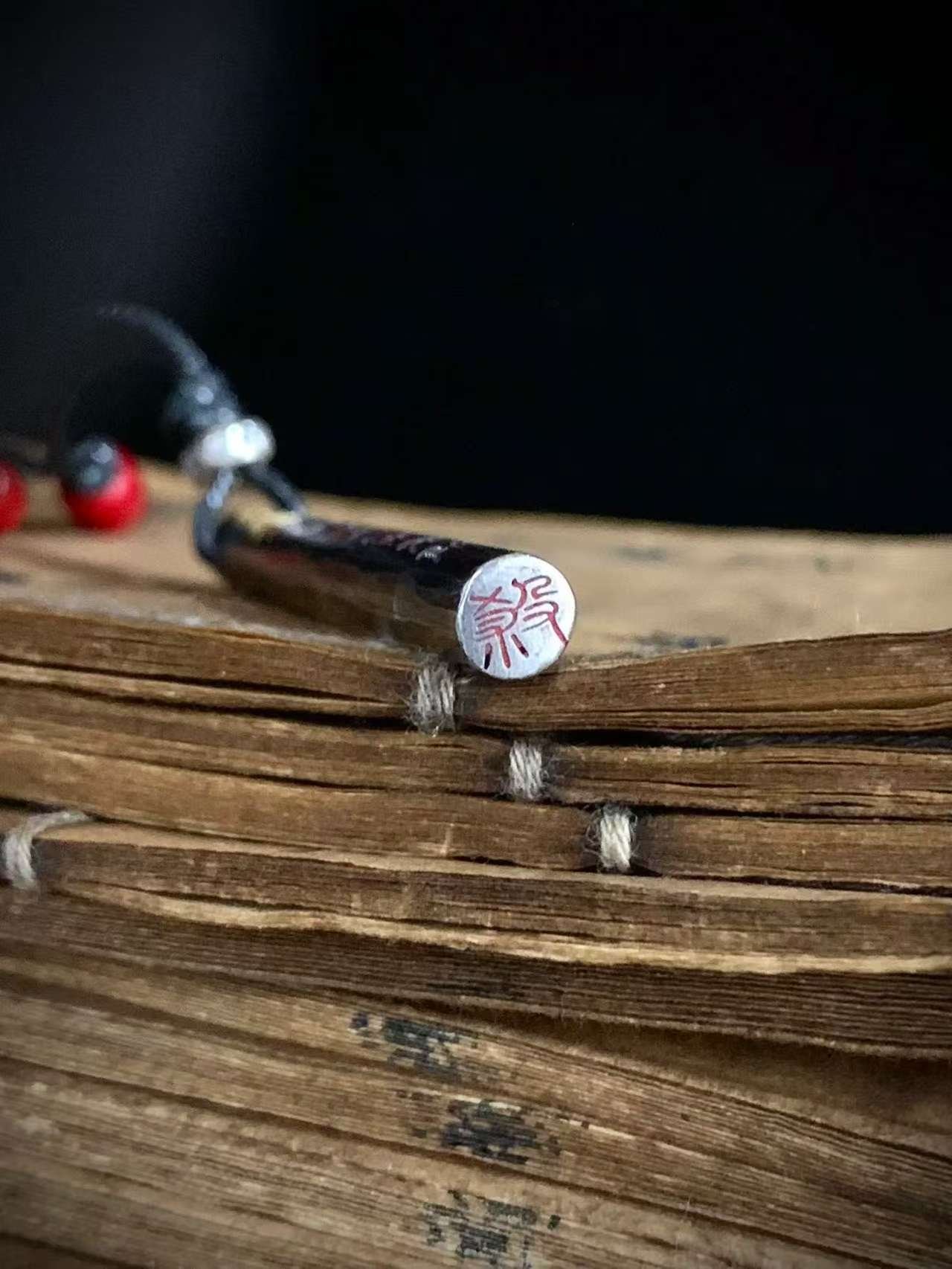 Kao Gui Rod 999 Silver Taoist Pendant — close view of one inscribed pendant end