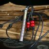 Kao Gui Rod 999 Silver Taoist Pendant — rod-shaped pendant with its cord coiled alongside