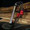 Kao Gui Rod 999 Silver Taoist Pendant — rod-shaped pendant with black cord and red beads
