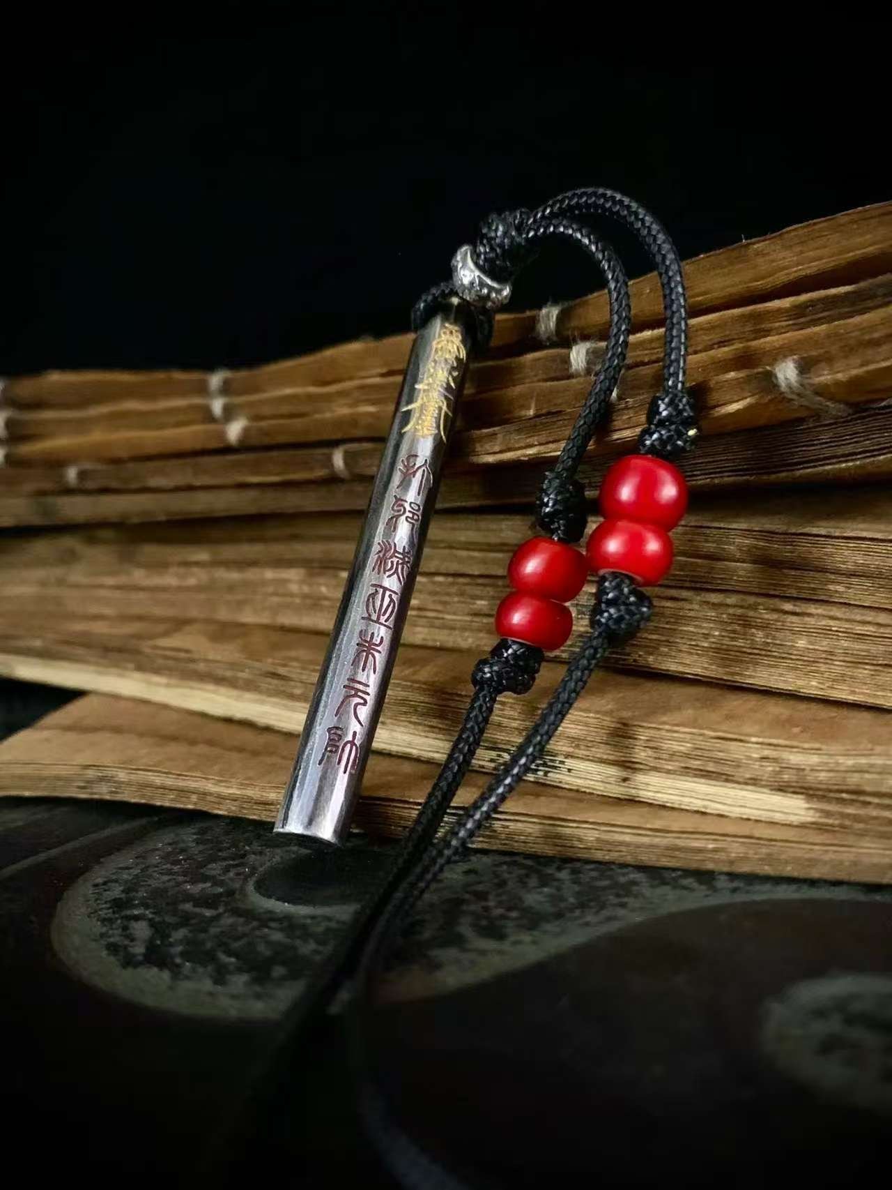 Kao Gui Rod 999 Silver Taoist Pendant — rod-shaped pendant with black cord and red beads