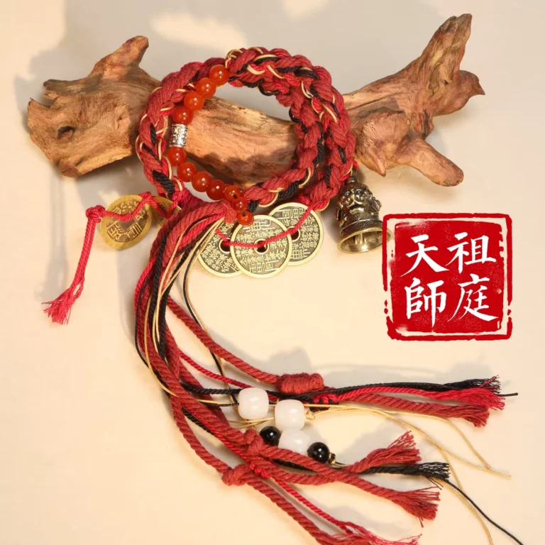 Lucky Bell Blessing Bracelet — red braided bracelet with dangling bell and tassels