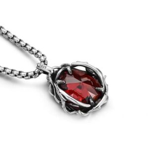 Man Mei (Twining Rose Gemstone) Pendant — close view of the red pendant resting on white
