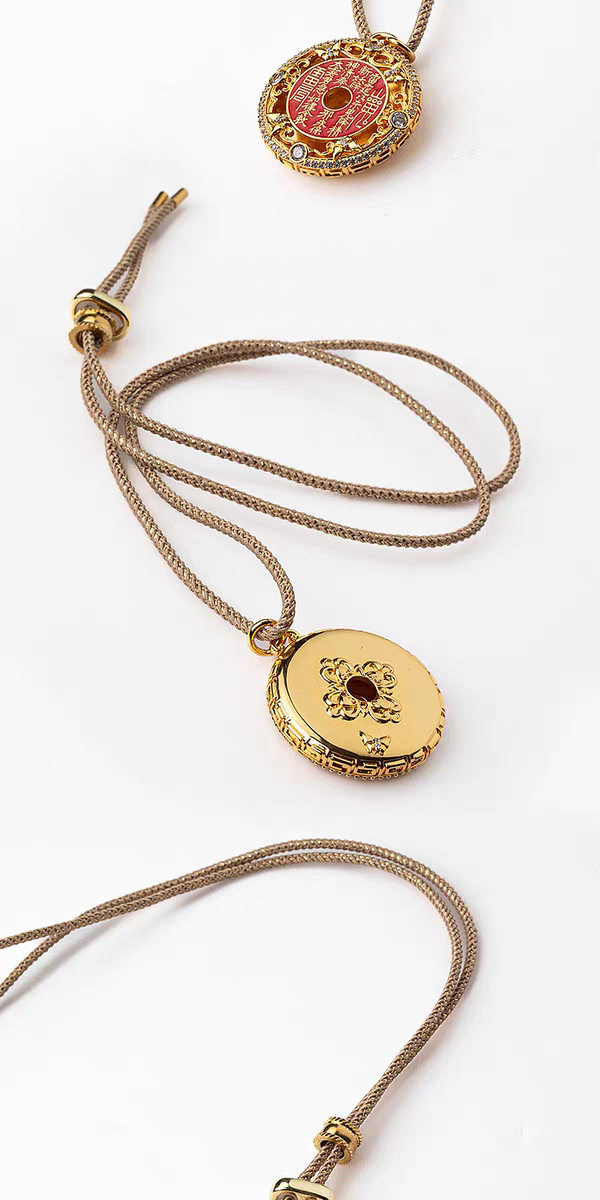 Mountain Spirit's Verse Pendant — two round pendant faces displayed with their cords