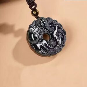 Pixiu Jade Pendant — dark carved circular pendant with a central opening