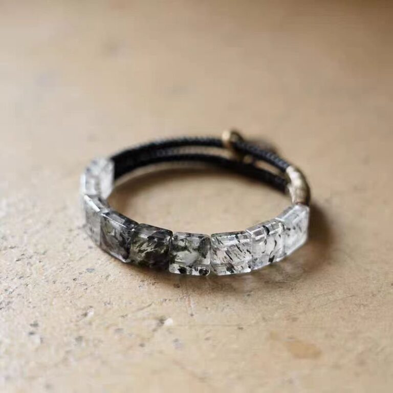 Qi Yao (Seven Luminaries) Bracelet — bracelet with translucent rectangular segments and a dark cord