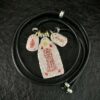 Six Ding & Six Jia 999 Silver Taoist Pendant — three-charm pendant with its cord arranged in a circle