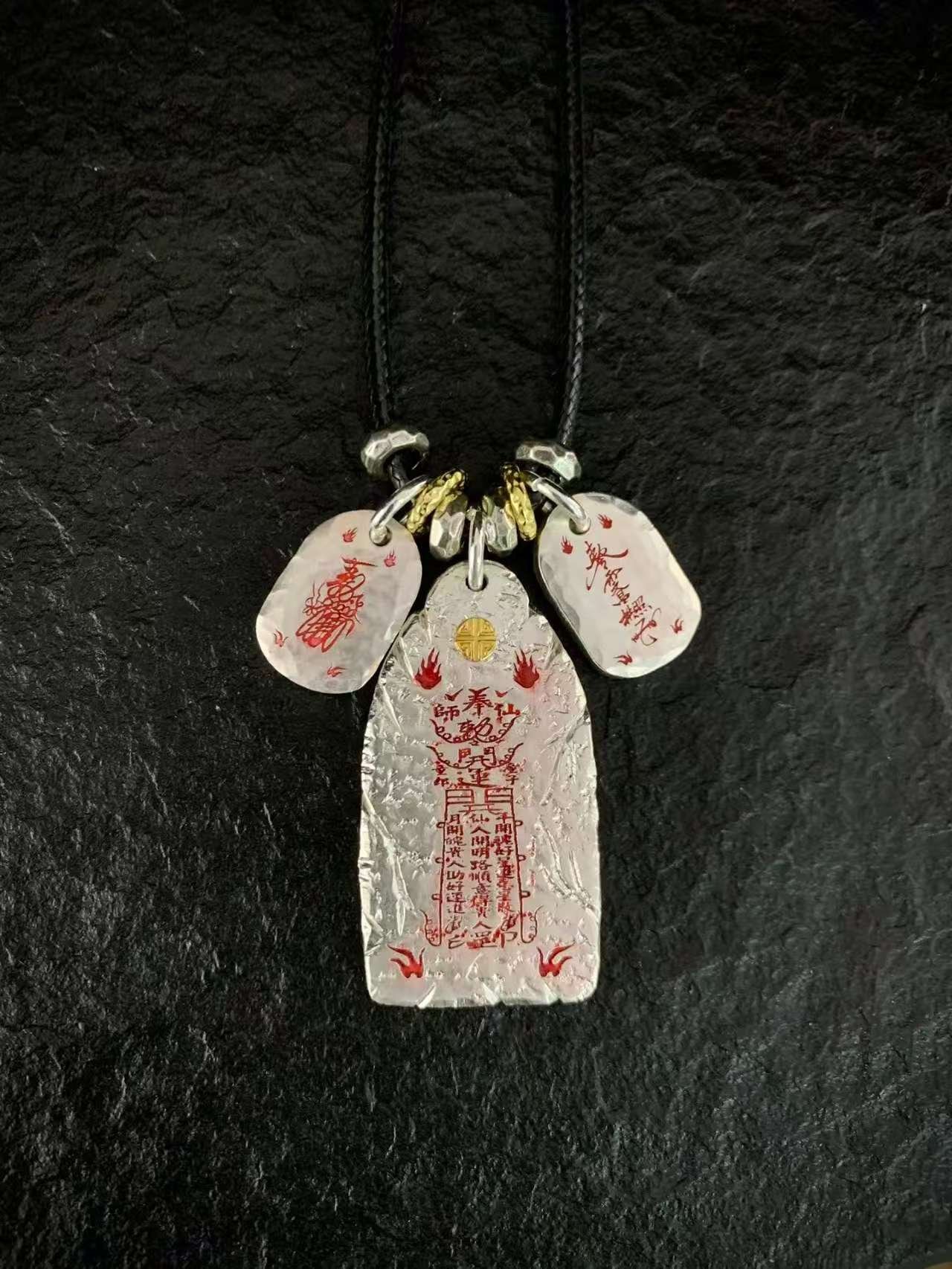 Six Ding & Six Jia 999 Silver Taoist Pendant — pendant with three inscribed charms shown on a black cord